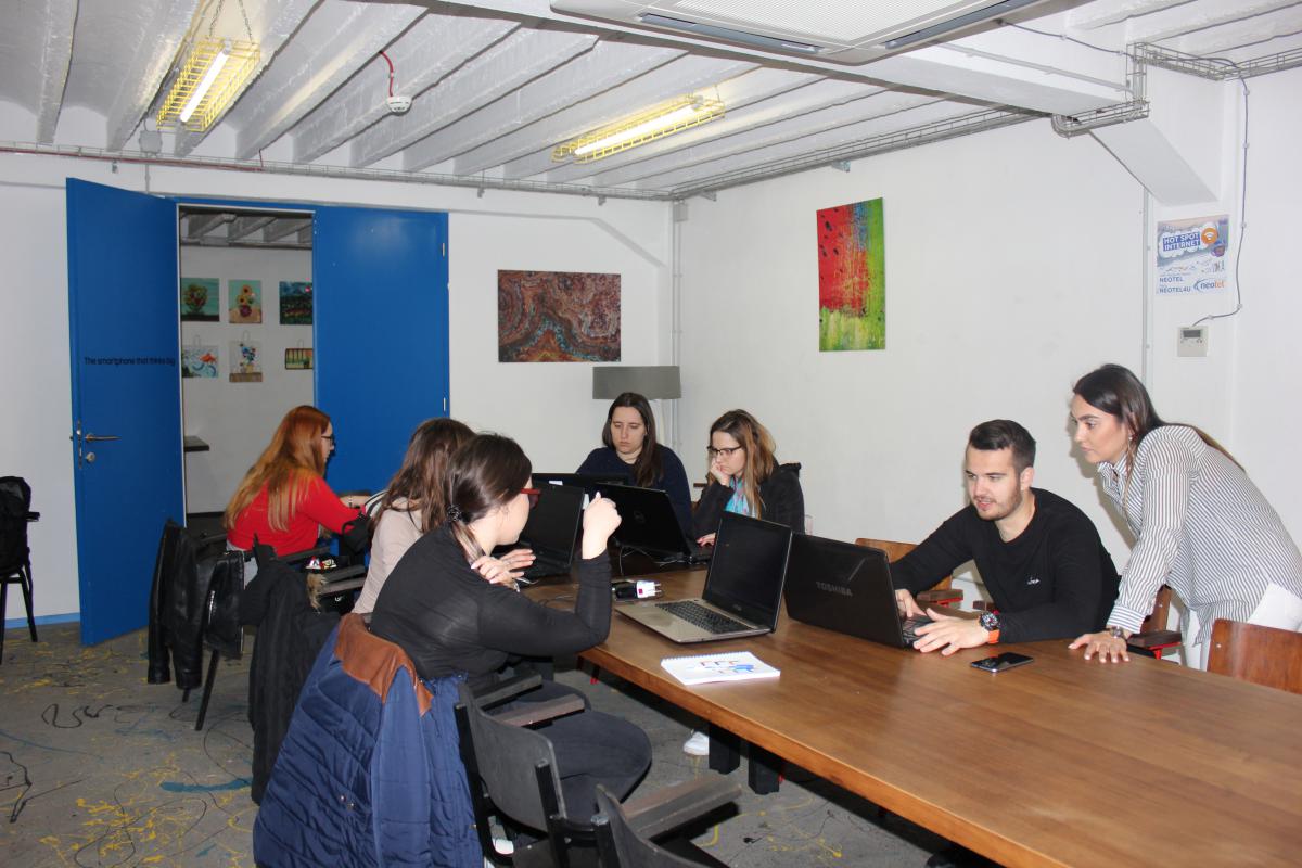 People working on computers during a QA workshop