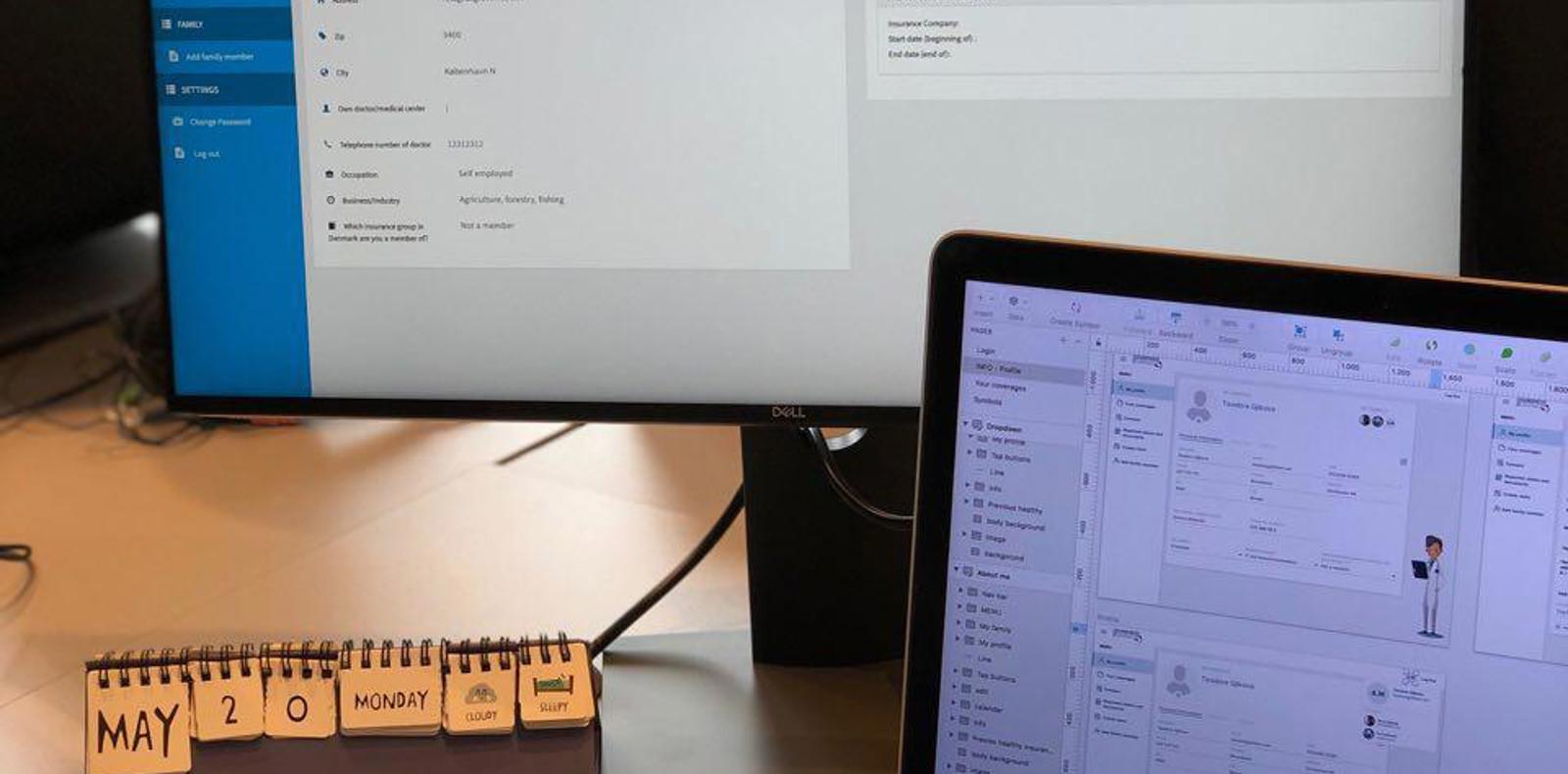 Planning and designing on a laptop and a desk monitor.