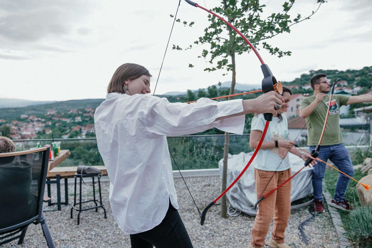 A woman holding bow and arrow