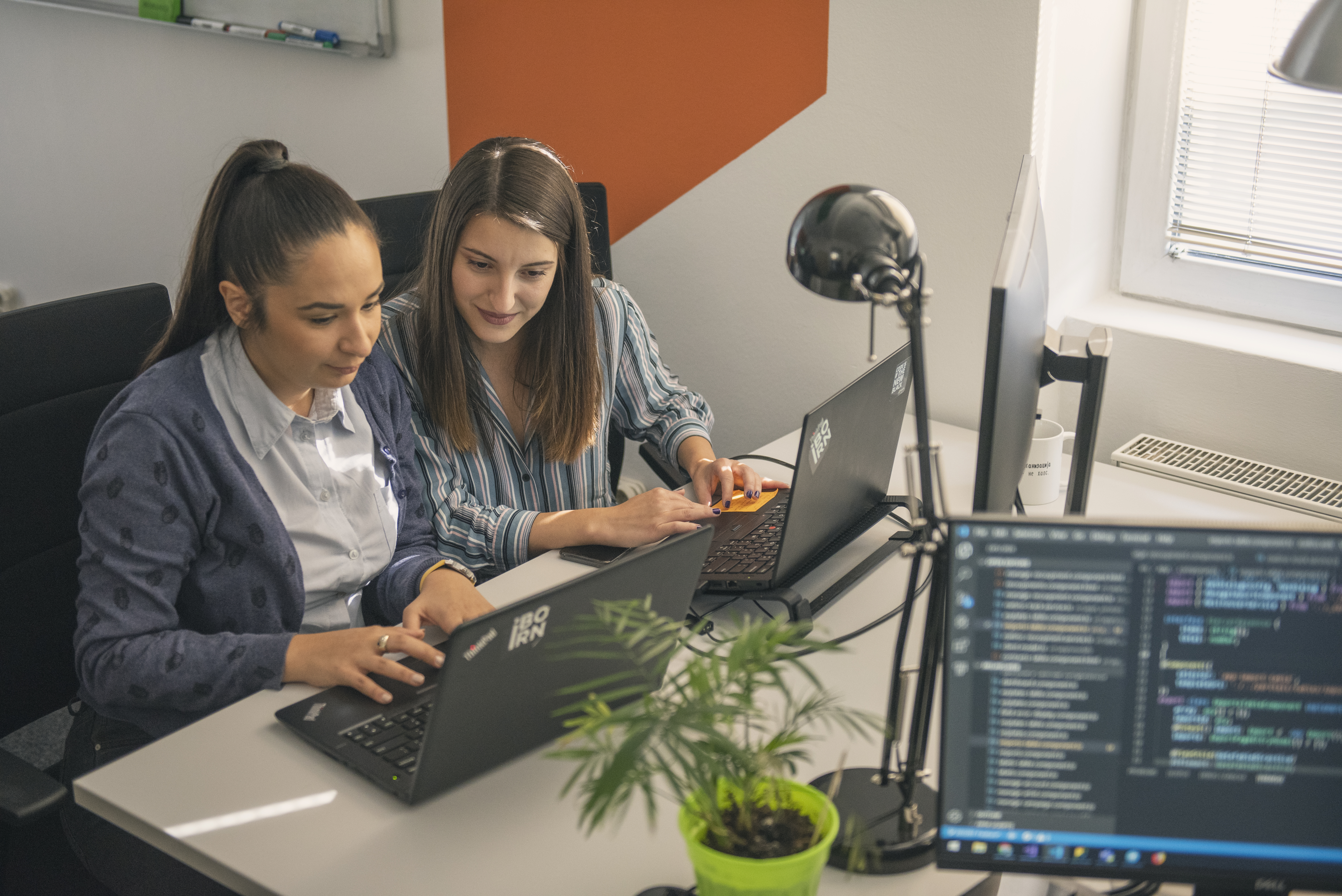 Data engineers working together in a modern office.