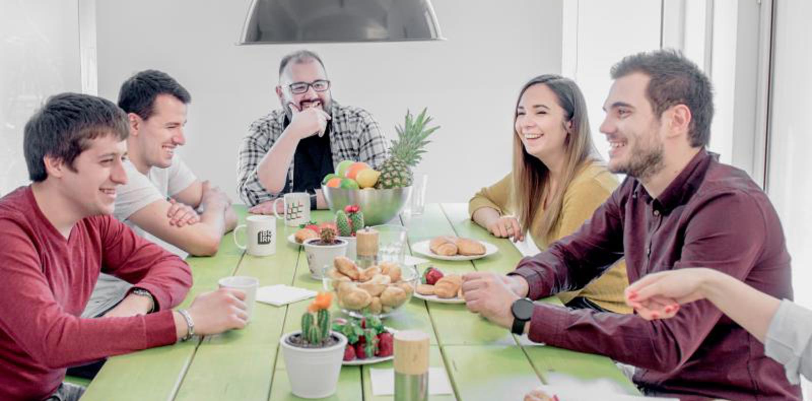 Group of colleagues having a lunch together.