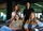 Women colleagues sitting together on a couch in an office.