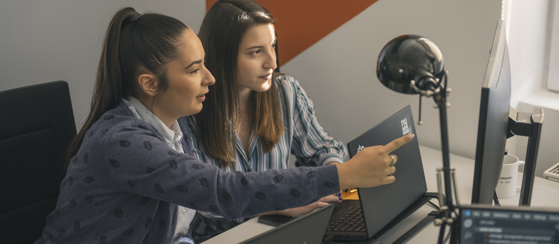 Group of data engineers working together in a bright office.