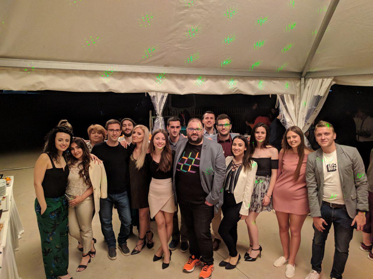 Iborn team smiling and posing together at the party for the 6th founding anniversary.