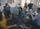 Employees focused on their work at computers in an office space.