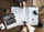 Two people with a laptop and a map, exploring new places and discussing over coffee where to travel.