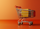 Minimalist shopping cart with packages on an orange background, symbolizing e-commerce cart abandonment and online shopping