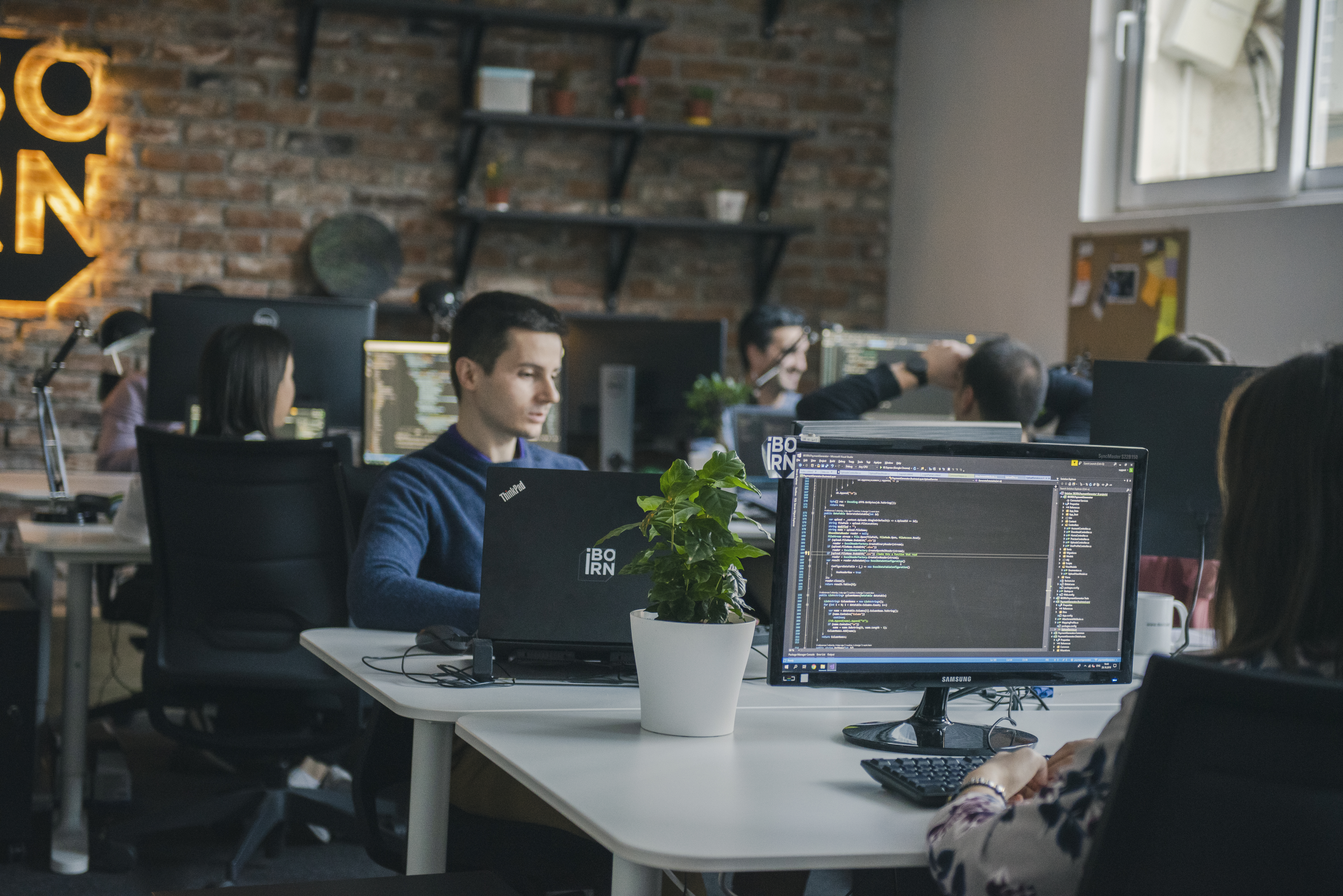 Software engineers working in a modern office environment.
