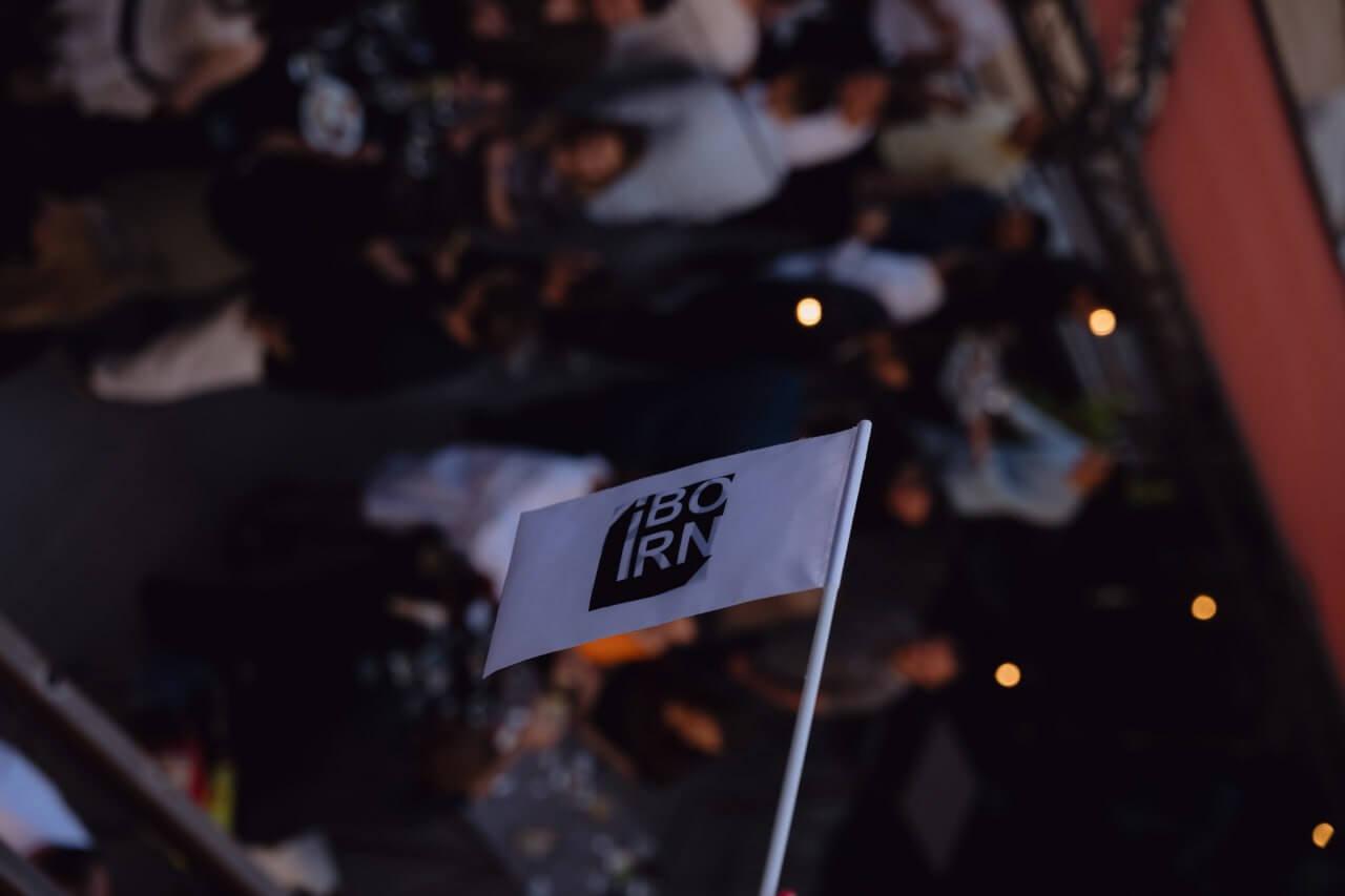 Flag with the IBORN logo on it.
