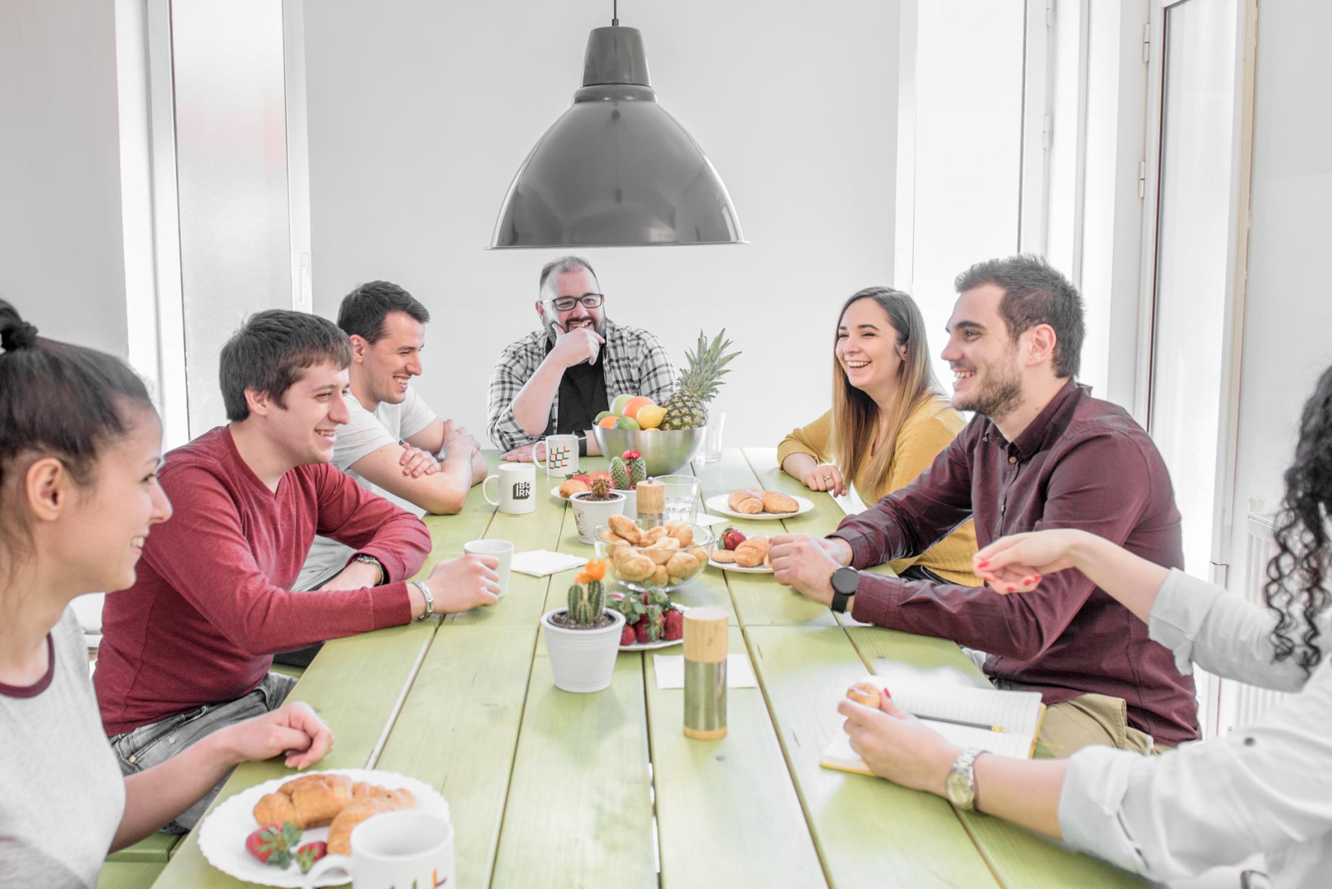 Group of colleague eating together. 