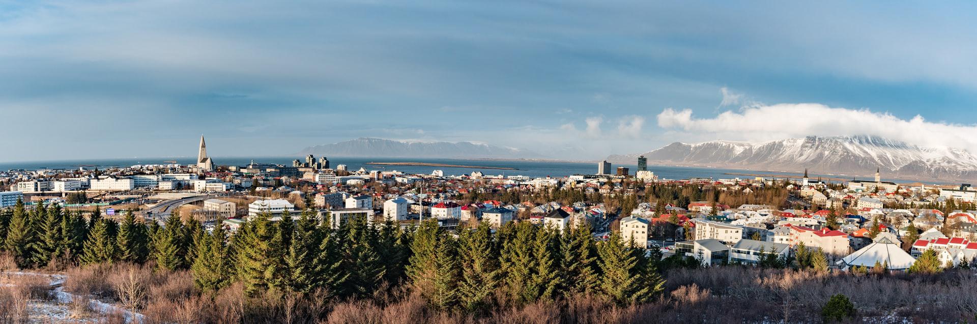 Reykjavik, Iceland: A vibrant cityscape with colorful buildings nestled amidst stunning natural landscapes.