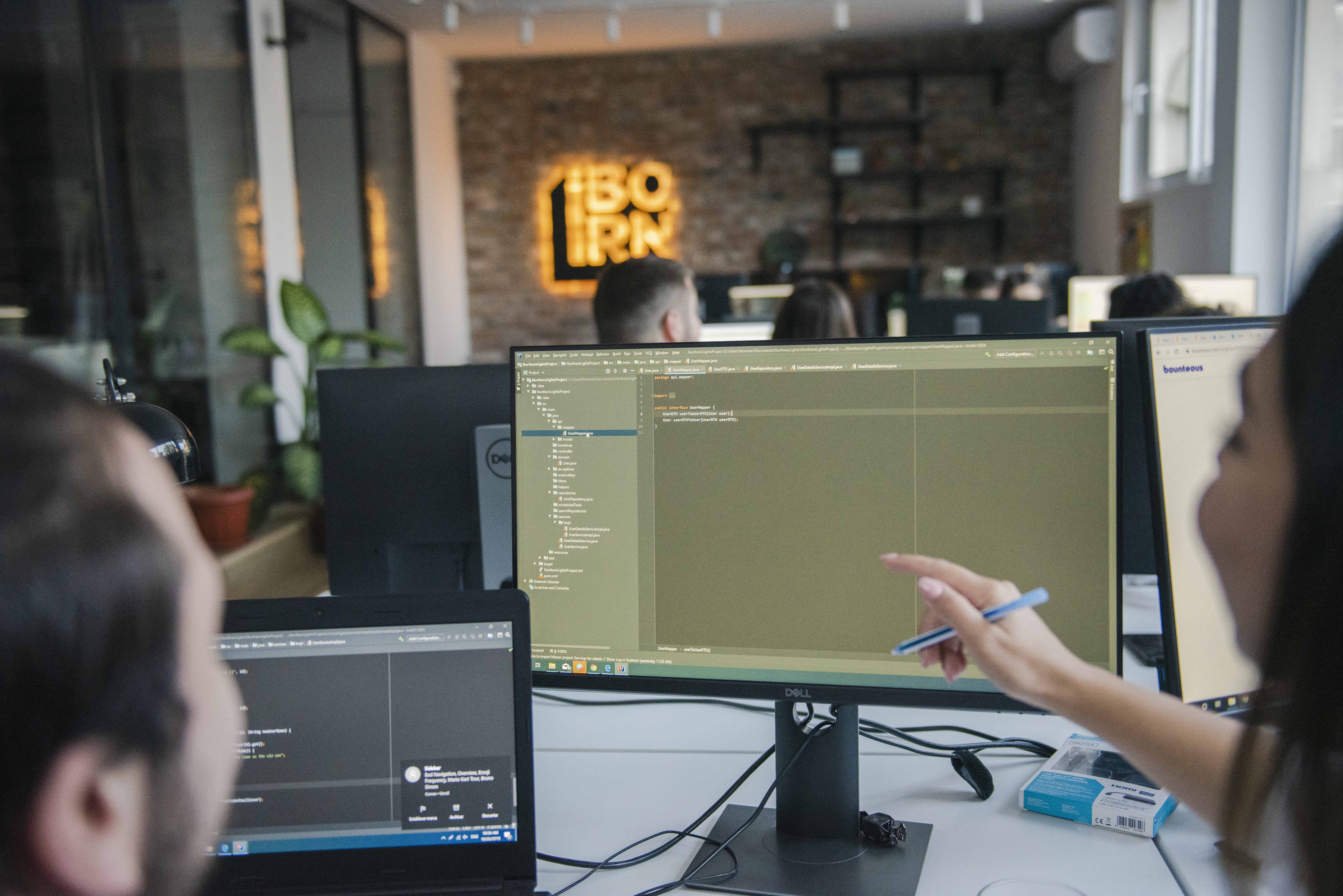 Software developer and a QA engineer working together. 